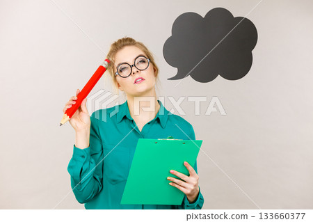 Business woman intensive thinking and writing Business woman intensive thinking and writing 133660377