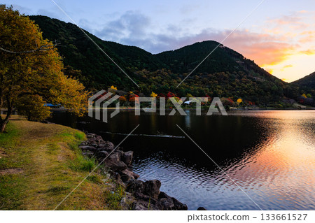 Autumn leaves at Imuta Pond and the lakeside at dusk - A tranquil autumn scene Autumn leaves at Imuta Pond and the lakeside at dusk - A tranquil autumn scene 133661527