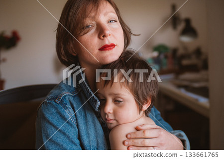 Heartfelt Embrace Between Mother and Son at Home 133661765