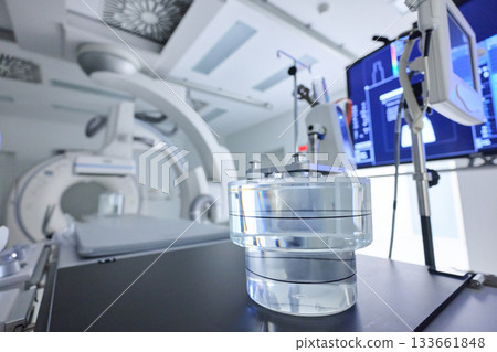 Advanced medical technology in a clinical setting showcasing a clear container for imaging procedures under bright lights 133661848
