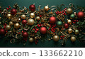 A bunch of Christmas ornaments are displayed on a green background 133662210