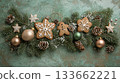 A green and white Christmas wreath with a variety of ornaments including cookies 133662221