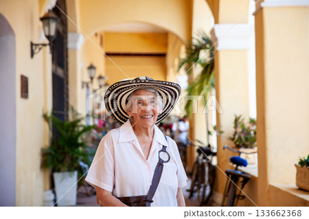 Senior travel. Senior woman at the beautiful heritage town of Mompox wearing the traditional Sombrero vueltiao. 133662368