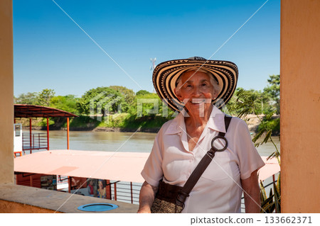 Senior travel. Senior woman at the beautiful heritage town of Mompox wearing the traditional Sombrero vueltiao. 133662371