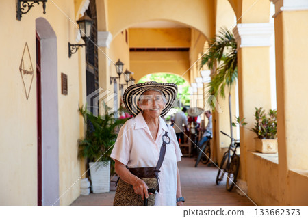 Senior travel. Senior woman at the beautiful heritage town of Mompox wearing the traditional Sombrero vueltiao. 133662373
