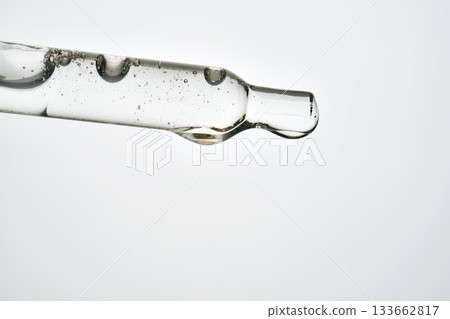 Cosmetic pipette dispensing serum for skin care treatment 133662817