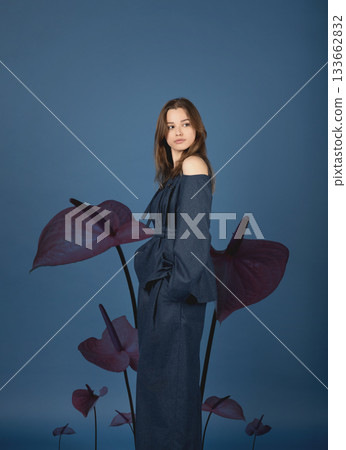 Beautiful woman with dark linen suit studio portrait in Anthurium flowers background Beautiful woman with dark linen suit studio portrait in Anthurium flowers background 133662832
