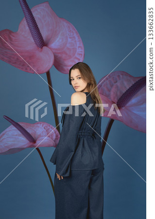 Beautiful woman with dark linen suit studio portrait in Anthurium flowers background Beautiful woman with dark linen suit studio portrait in Anthurium flowers background 133662835