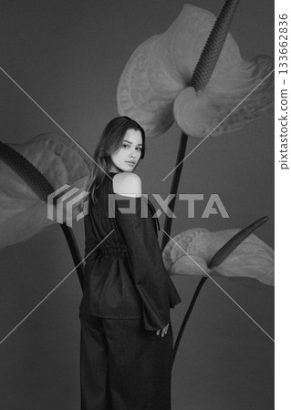 Beautiful woman with dark linen suit studio portrait in Anthurium flowers background Beautiful woman with dark linen suit studio portrait in Anthurium flowers background 133662836