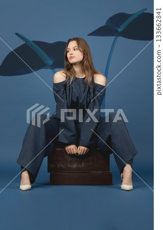 Beautiful woman with dark linen suit studio portrait in Anthurium flowers background Beautiful woman with dark linen suit studio portrait in Anthurium flowers background 133662841