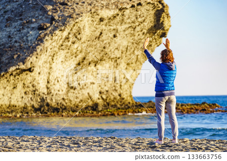 Woman walk on Monsul beach, Park Cabo de Gata, Spain Woman walk on Monsul beach, Park Cabo de Gata, Spain 133663756
