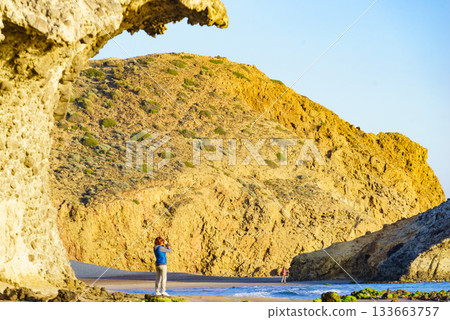 People walk on Monsul beach, Park Cabo de Gata, Spain People walk on Monsul beach, Park Cabo de Gata, Spain 133663757