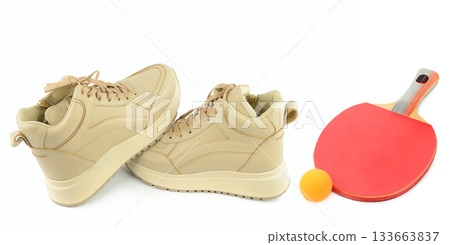 Beige Sneakers and Table Tennis Racket on White Background 133663837