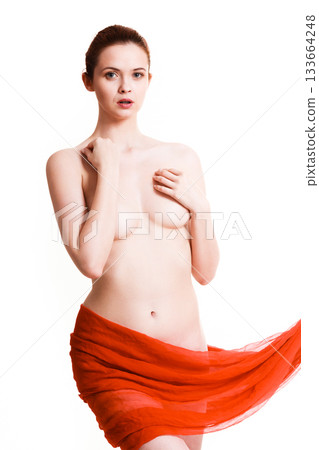 Woman with red textile on hips covering her breast 133664248