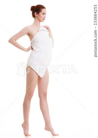 Naked woman in towel after bath 133664255