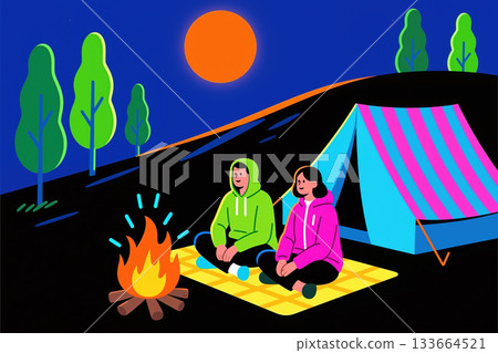 Couple camping at night with a campfire. 133664521