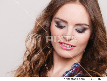 Attractive woman wearing checkered shirt 133664618