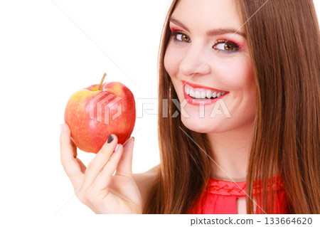 Woman charming girl colorful makeup holds apple fruit 133664620