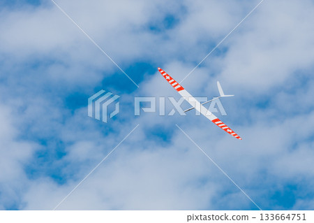 RC soaring plane on blue sky RC soaring plane on blue sky 133664751