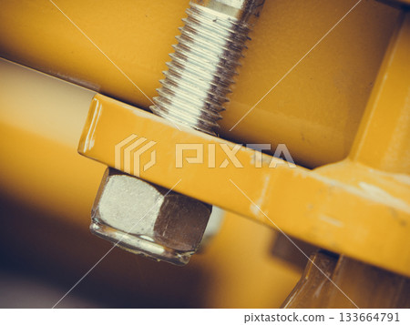 Screws on steel big machinery closeup Screws on steel big machinery closeup 133664791