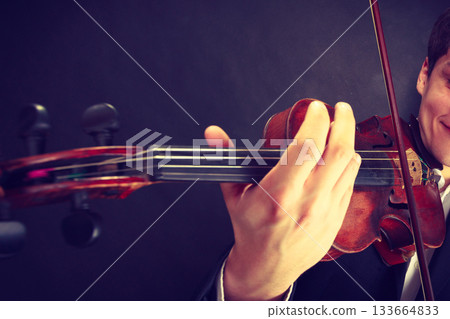 Man man dressed elegantly playing violin Man man dressed elegantly playing violin 133664833