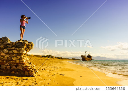 Tourist take photo on beach sea shore Tourist take photo on beach sea shore 133664838