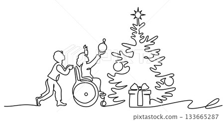 Child in wheelchair decorates a Christmas tree together with friend. 133665287