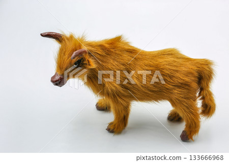 Furry miniature animal figure closeup on white. Furry miniature animal figure closeup on white. 133666968