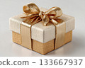 Holiday celebrations. Gold box wrapped with a bow on white background. Jewelry, birthdays, Christmas and luxury branding. 133667937