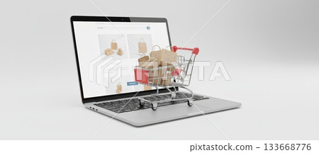 Miniature shopping cart filled with gift boxes and paper bags sitting on an open laptop displaying an e commerce website, symbolizing modern online shopping and retail checkout 133668776