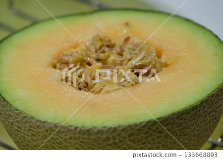 Delicious melon cut in half Delicious melon cut in half 133668893