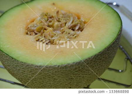 Delicious melon cut in half Delicious melon cut in half 133668898