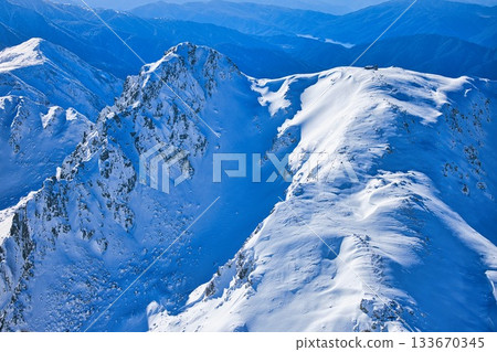 Mount Ryuo and Mount Jodo in the snow-capped Tateyama mountain range of the Northern Alps Mount Ryuo and Mount Jodo in the snow-capped Tateyama mountain range of the Northern Alps 133670345