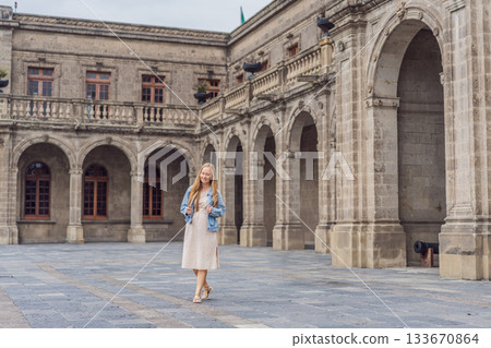 Young woman tourist standing near Chapultepec Castle in Mexico City, exploring the historic landmark. Solo travel, cultural heritage, tourism, and adventure concept Young woman tourist standing near Chapultepec Castle in Mexico City, exploring the historic landmark. Solo travel, cultural heritage, tourism, and adventure concept 133670864