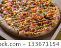 Close-Up of Freshly Baked Pizza with Colorful Toppings 133671154
