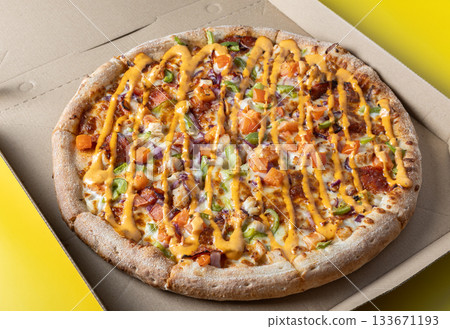 Fresh Gourmet Pizza in Open Box with Vibrant Toppings 133671193