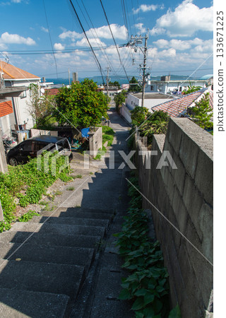 A clear sky, a cityscape with an emerald green sea, and a downhill slope A clear sky, a cityscape with an emerald green sea, and a downhill slope 133671225