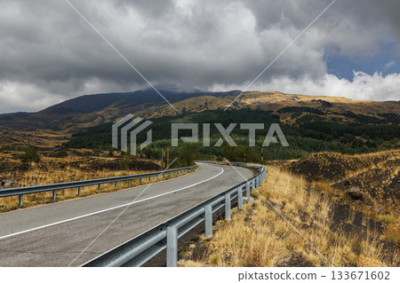 Mountain road on Mount Etna volcano in Sicily, Italy 133671602