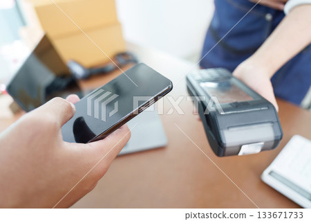 Digital Payment. Customer using smartphone for contactless payment. 133671733