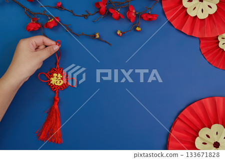 Hand Holding Traditional Chinese New Year Decoration Hand Holding Traditional Chinese New Year Decoration 133671828