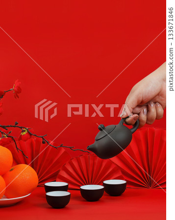 Chinese New Year tea ceremony with teapot and oranges 133671846