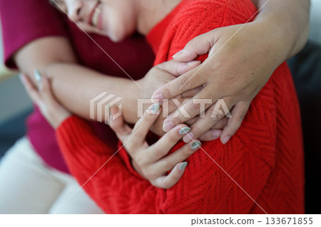 Tender Touch. Close-up of hands embracing in a loving moment. Tender Touch. Close-up of hands embracing in a loving moment. 133671855