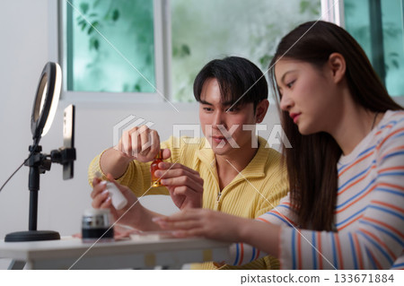 Couple Applying Skincare Products Together in Home Studio Couple Applying Skincare Products Together in Home Studio 133671884