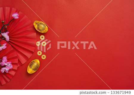 Chinese New Year decorations with gold ingots and flowers Chinese New Year decorations with gold ingots and flowers 133671949