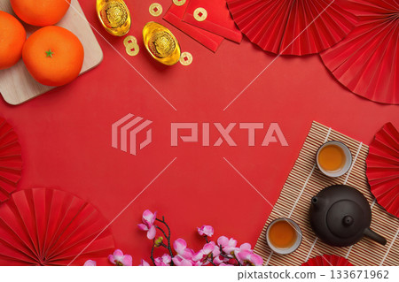 Chinese New Year background with oranges and tea set, top view 133671962