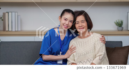Caregiver and elderly woman sharing a joyful moment together Caregiver and elderly woman sharing a joyful moment together 133671969