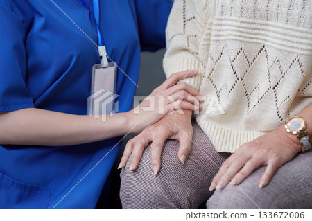 Caregiver providing emotional support to elderly woman 133672006