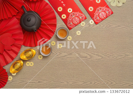 Elegant Chinese New Year setting with tea and gold ingots 133672012