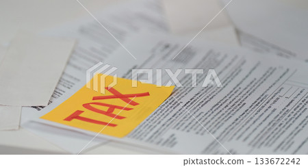 Tax documentation. Close-up of tax forms with a focus on important details. Tax documentation. Close-up of tax forms with a focus on important details. 133672242