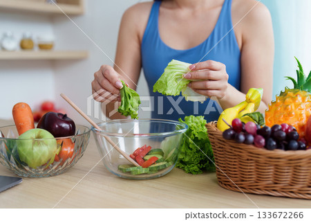 Food Wellness: Creating a Colorful Salad with Fresh Ingredients 133672266